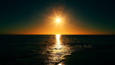 body of water during sunset