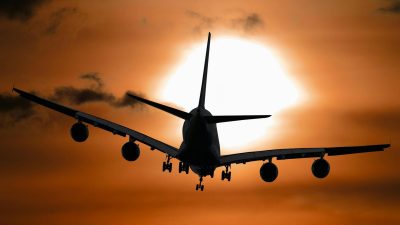 shadow image of a plane flying during sunset