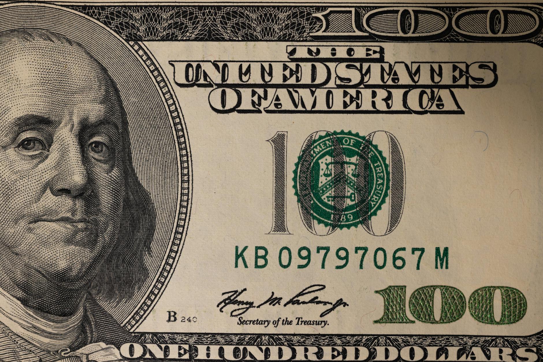 close up photography of one hundred dollar bill