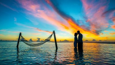 silhouette photo couple kissing each other during sunset