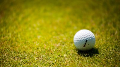 white golf ball on green grass