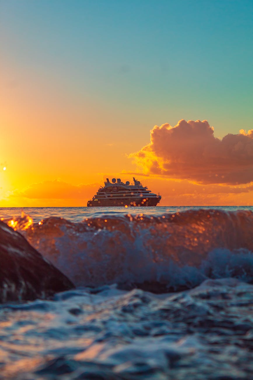 ferry ship on sea during dusk