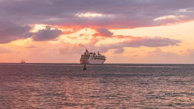a cruise ship sailing during sunset