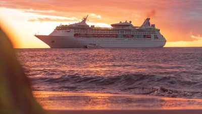 a cruise ship sailing during sunset