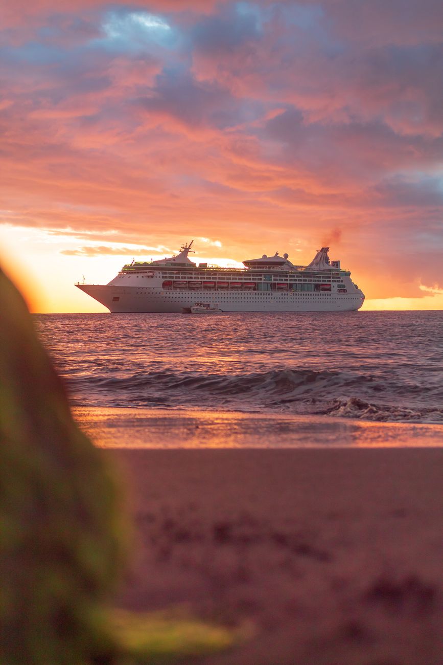 a cruise ship sailing during sunset