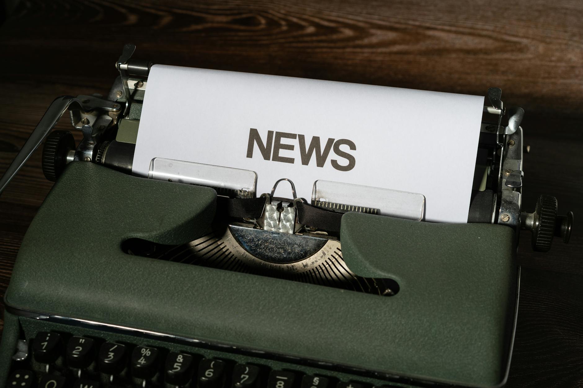 white paper on a green typewriter