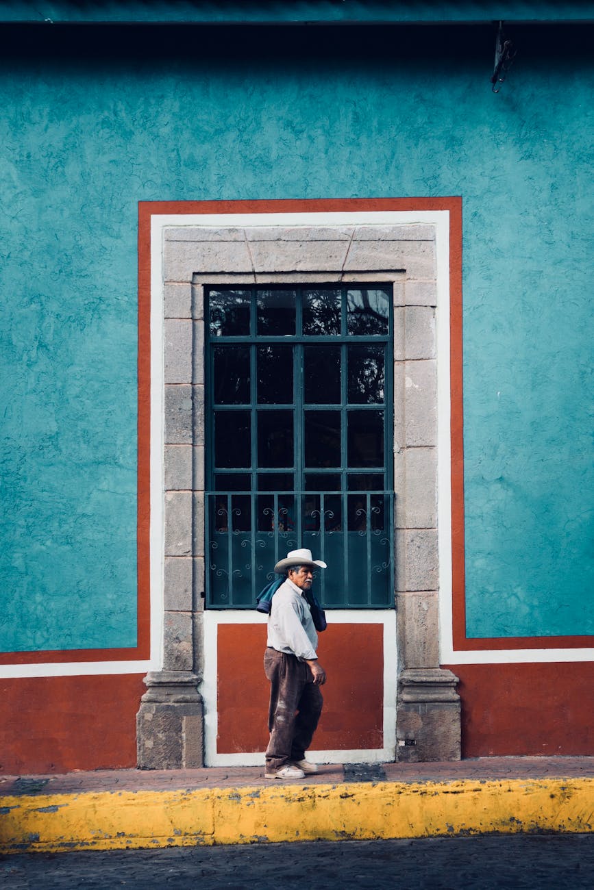 man standing in front of window