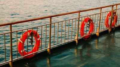 lifebuoys hanging on ship railing