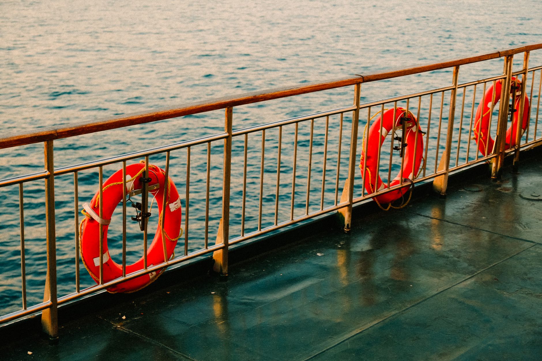 lifebuoys hanging on ship railing