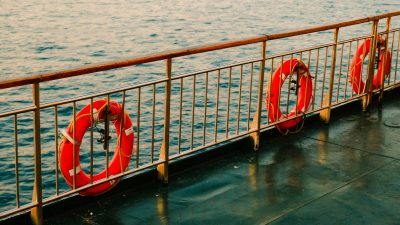 lifebuoys hanging on ship railing