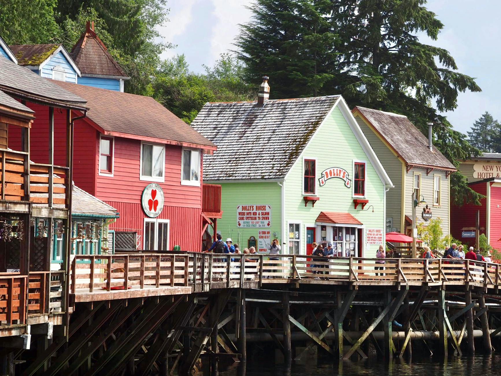 people walking on wooden dock