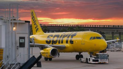 yellow passenger plane on the airport during sunset