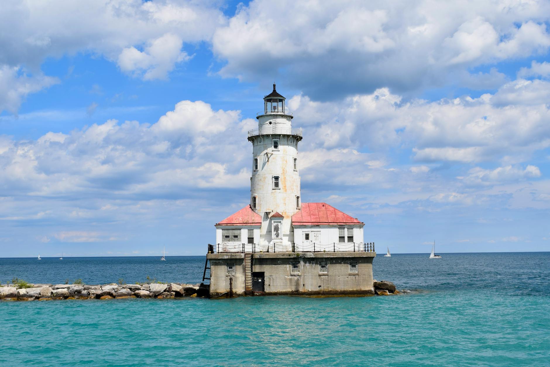 white lighthouse tower under the blue sky