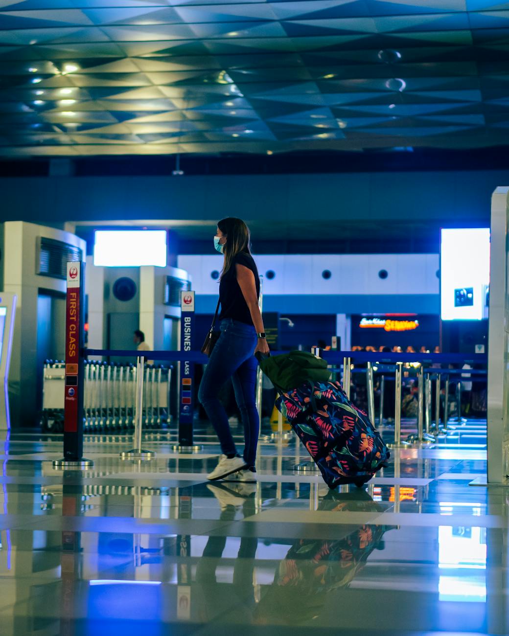 woman with luggage at airport