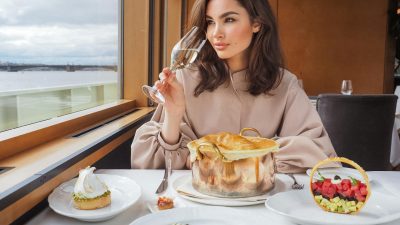 beautiful woman eating a meal on a cruise