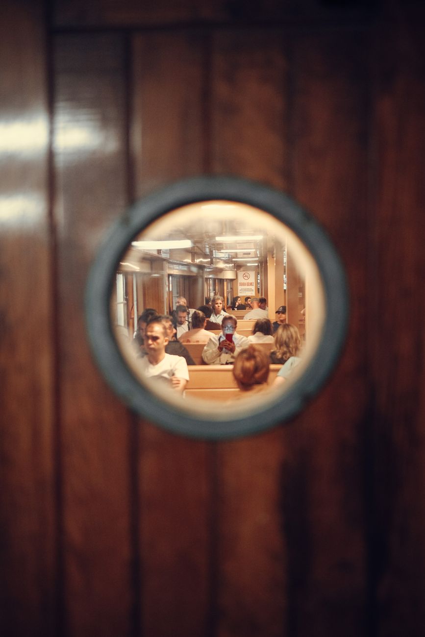 people sitting inside the ship