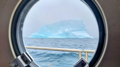 iceberg on sea viewed from ship