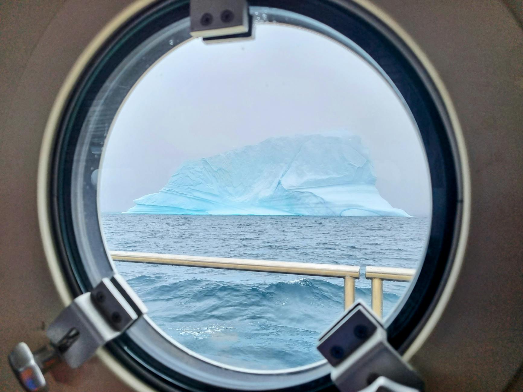 iceberg on sea viewed from ship