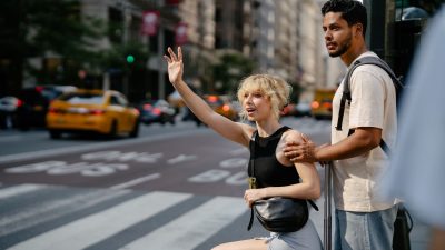 a couple calling a taxi