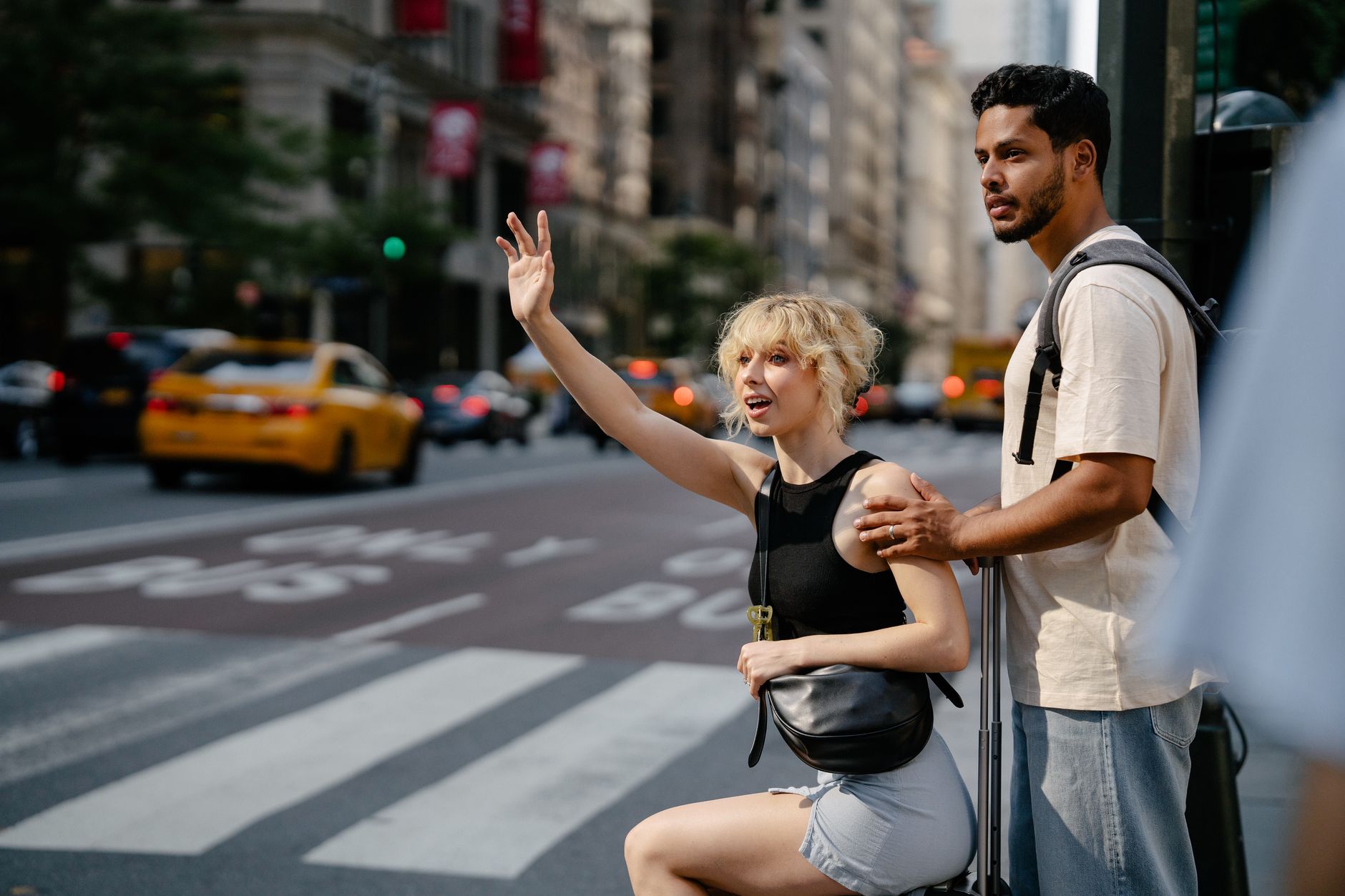 a couple calling a taxi
