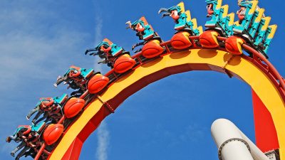 people riding roller coaster