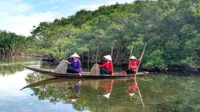 women on a wooden boat