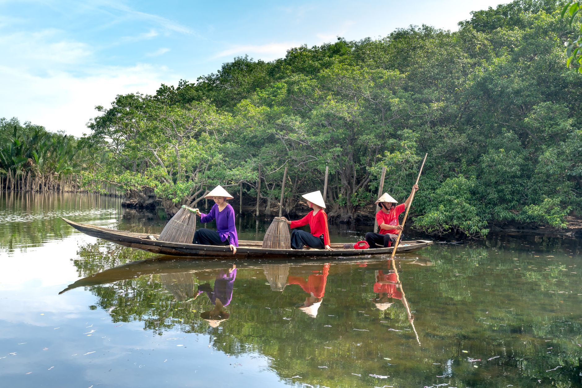 women on a wooden boat