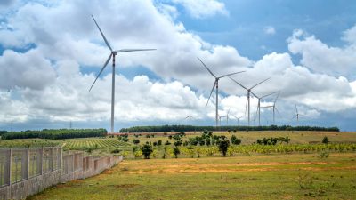 a wind turbines on grass field