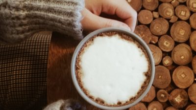 cup of coffee an a wooden table top