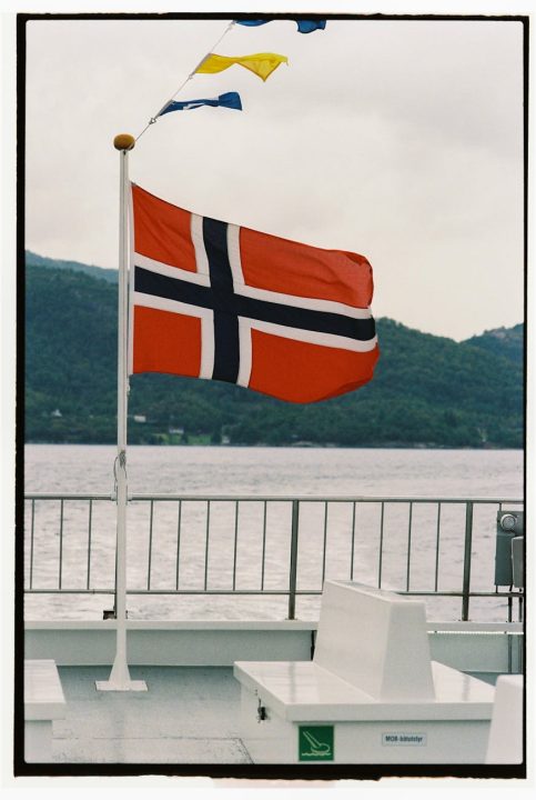 norway flag on deck near water