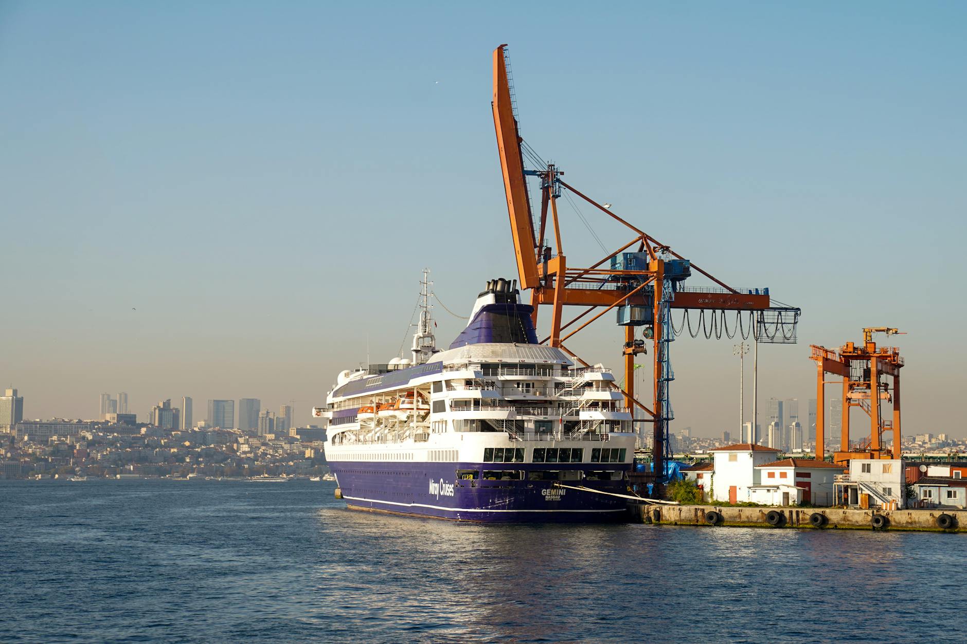 white and purple ship on sea