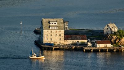 house on an island in the middle of sea