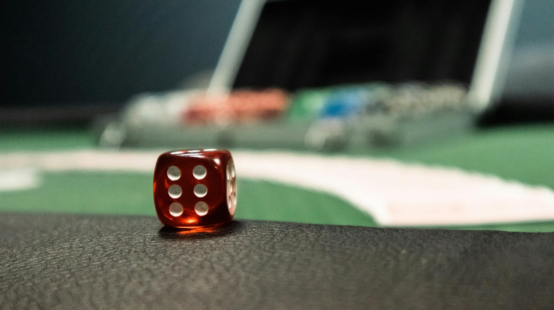 red dice on black surface