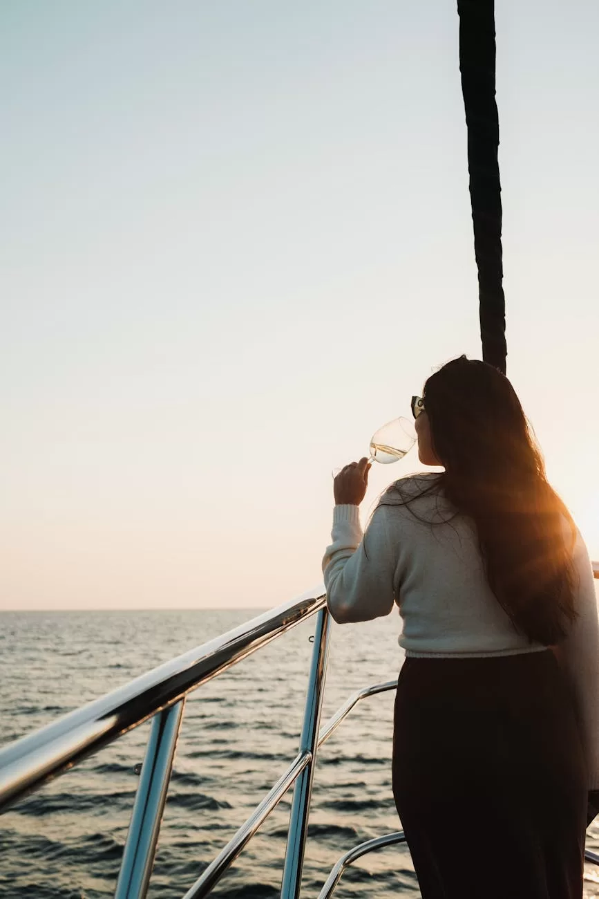 woman drinking and sailing at sunset