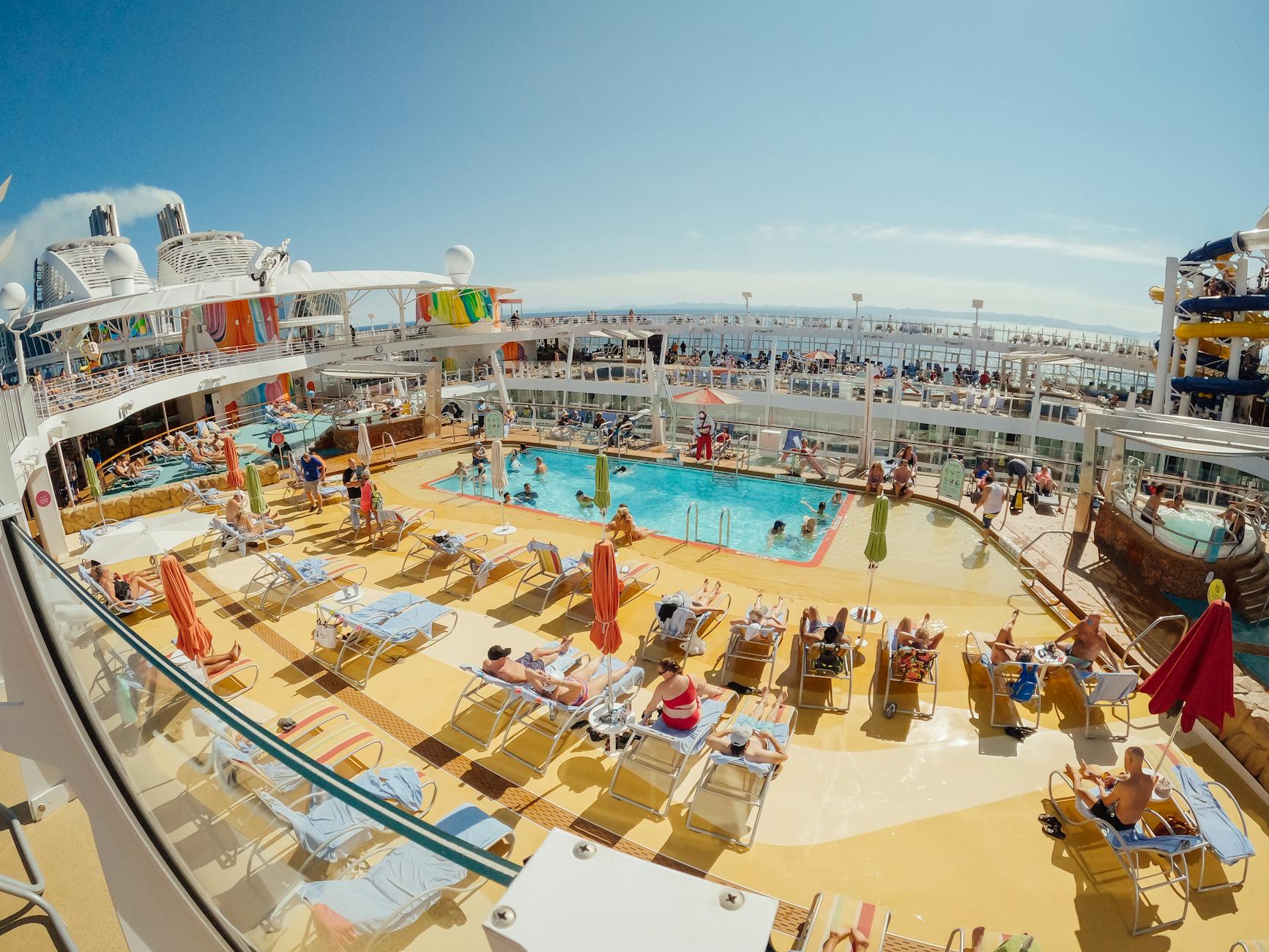 passengers by swimming pool on oasis of the seas cruise ship