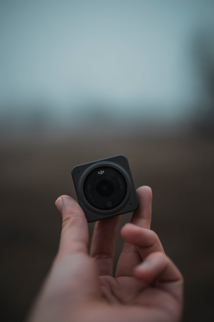 hand holding dji action camera
