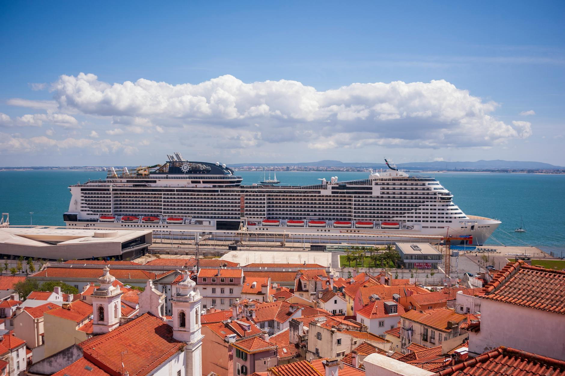 photo of a cruise ship in a coastal town