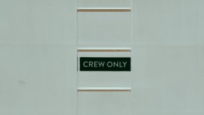 crew only text on board behind ladder