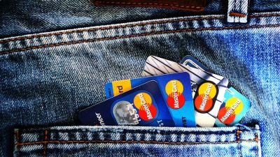 blue master card on denim pocket