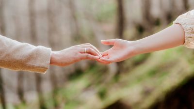 touching hands of man and woman