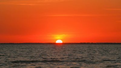 red sky over sea at sunset