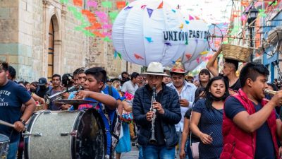 city street and parade with musicians