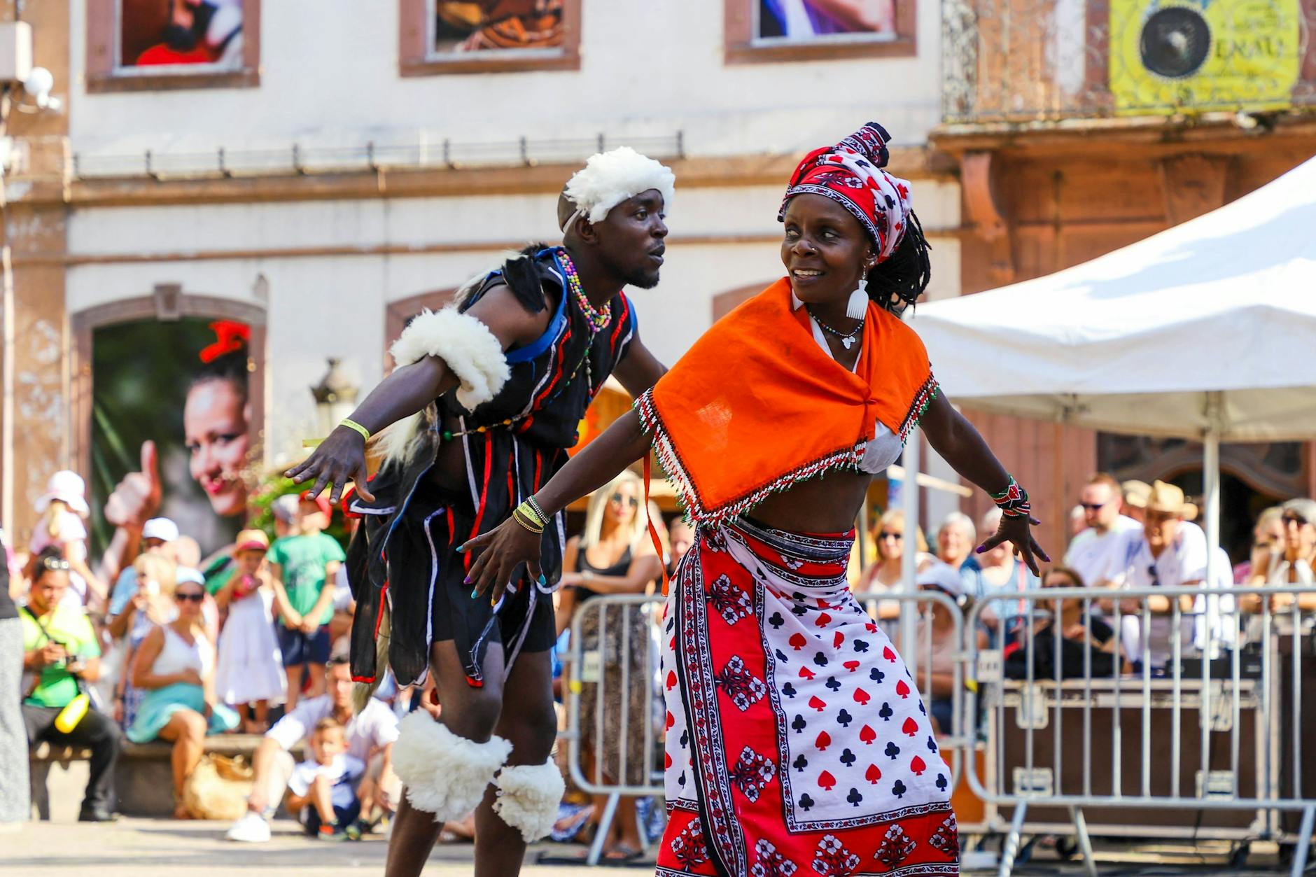 woman and man dancing in traditional clothing