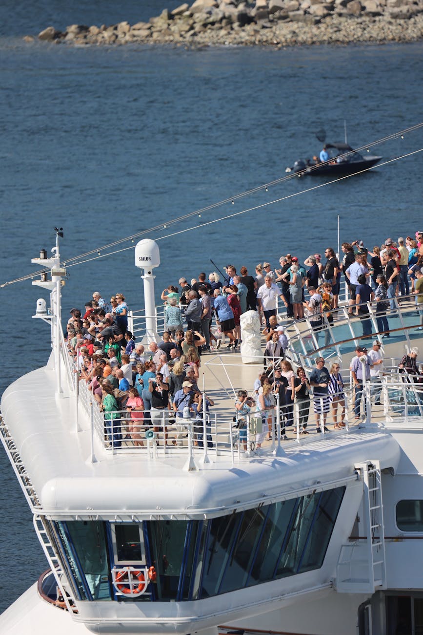 people on passenger ship on sea coast