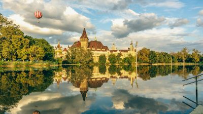 vajdahunyad castle reflecting in river