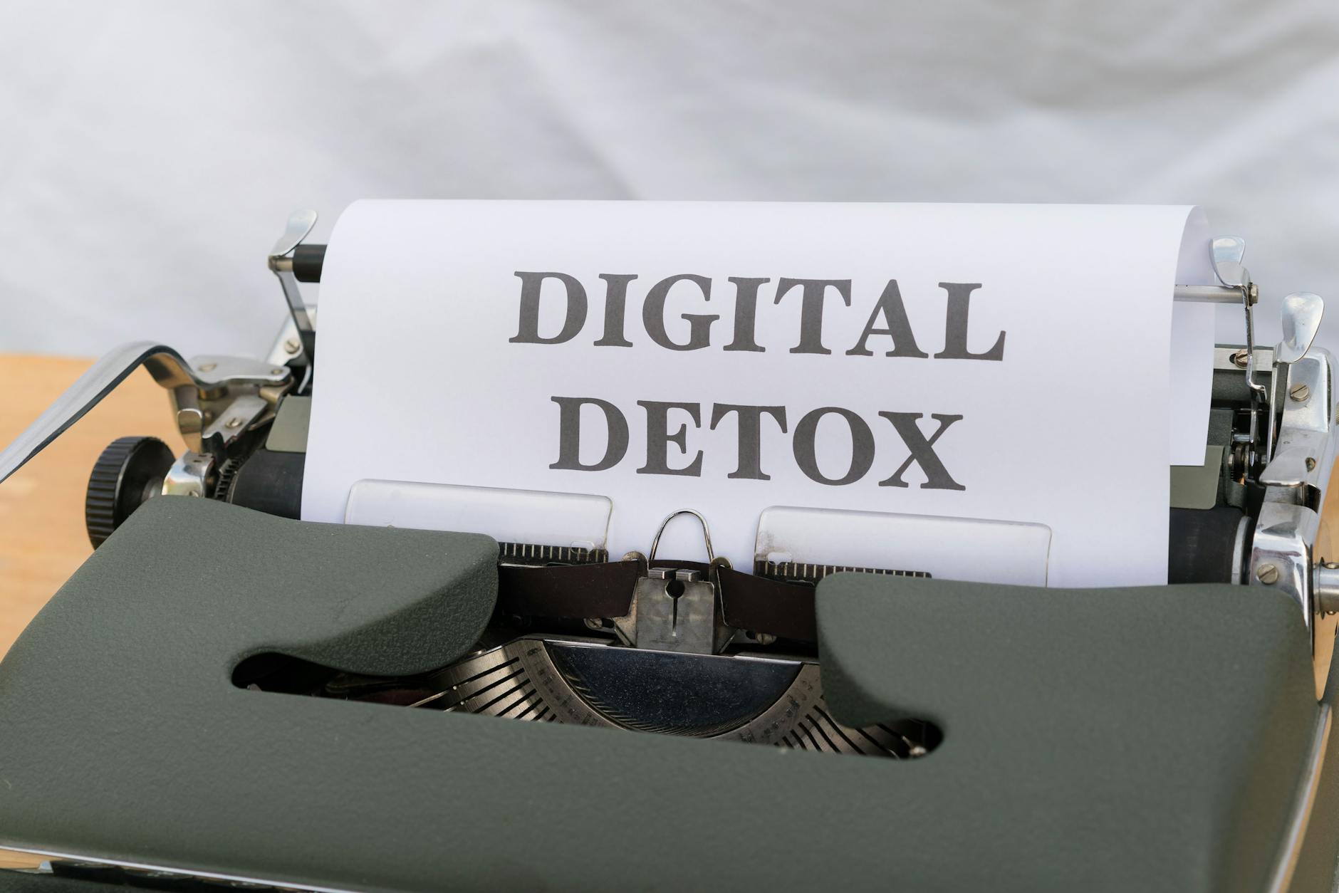 a typewriter with a paper that says digital detox