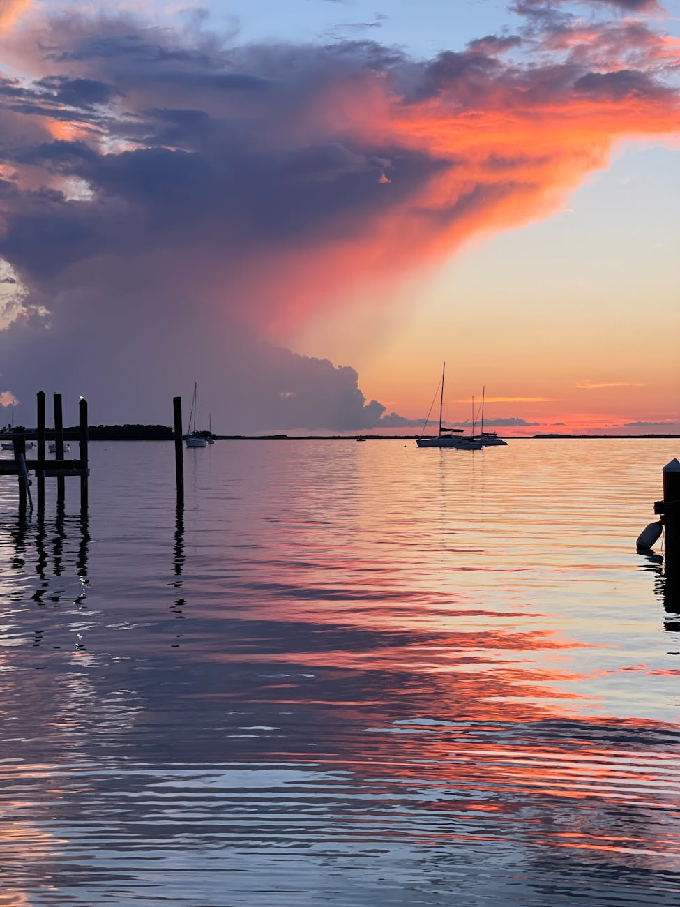rain cloud on sea coast at sunset