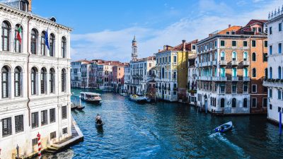 view of the grand canal gondolas and residential buildings on the sides of the canal venice italy