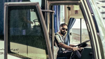 man riding a bus