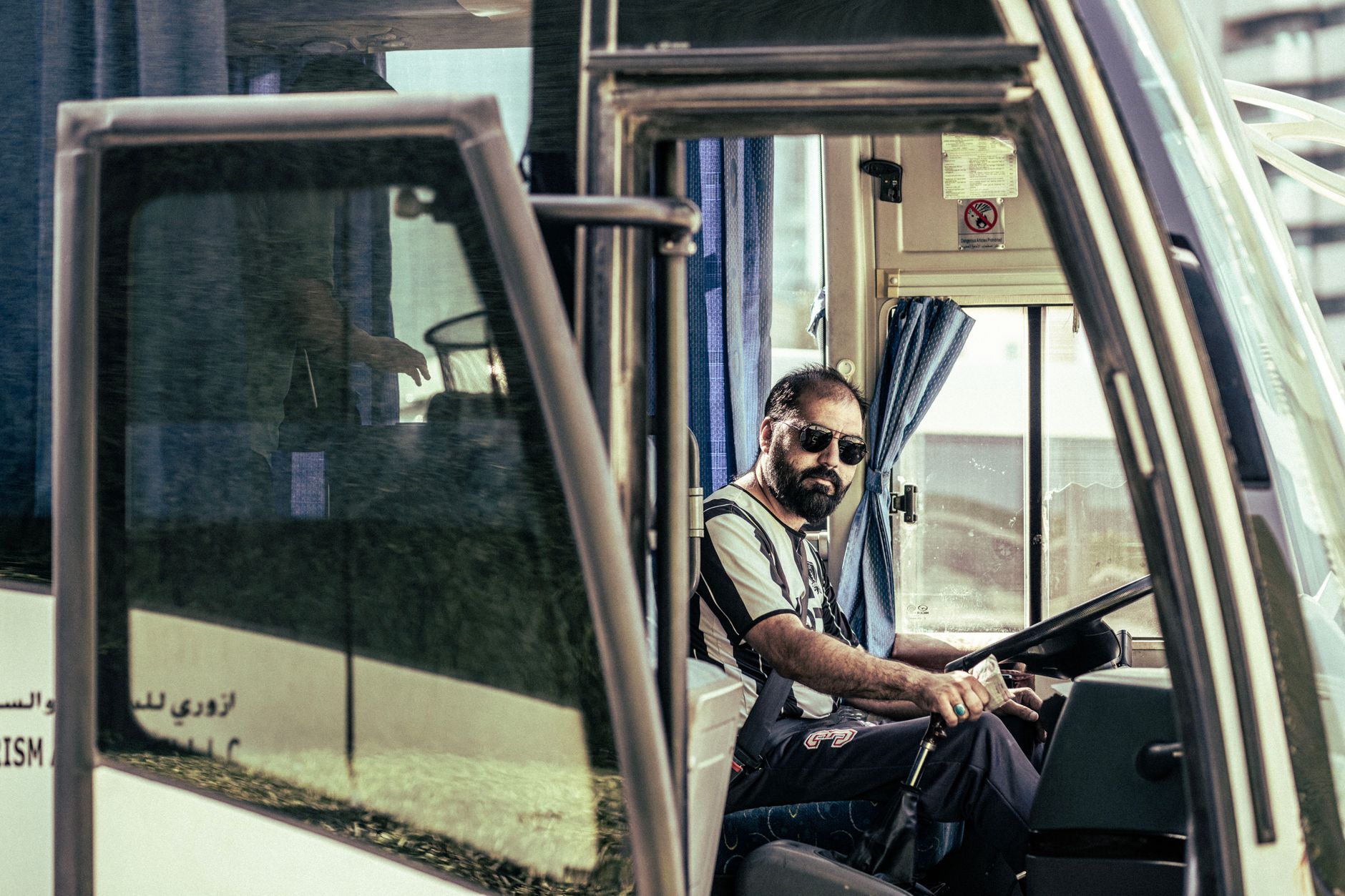 man riding a bus